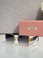 Gold square sunglasses with dark gradient lenses and patterned gold temple details