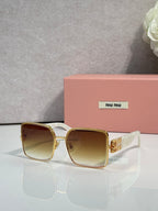 Gold square sunglasses with brown gradient lenses and gold-tone frame accents