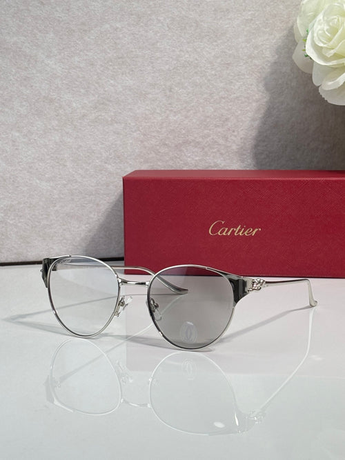 Cartier sunglasses with silver metal frame and tinted lenses, round shape
