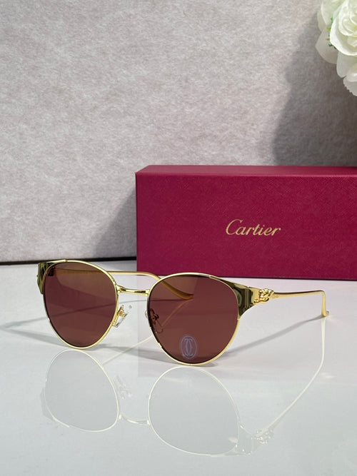 Cartier glasses with gold-tone round frames and burgundy tinted lenses