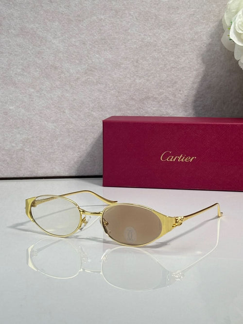Gold eyeglasses with round lenses and slim metal bridge