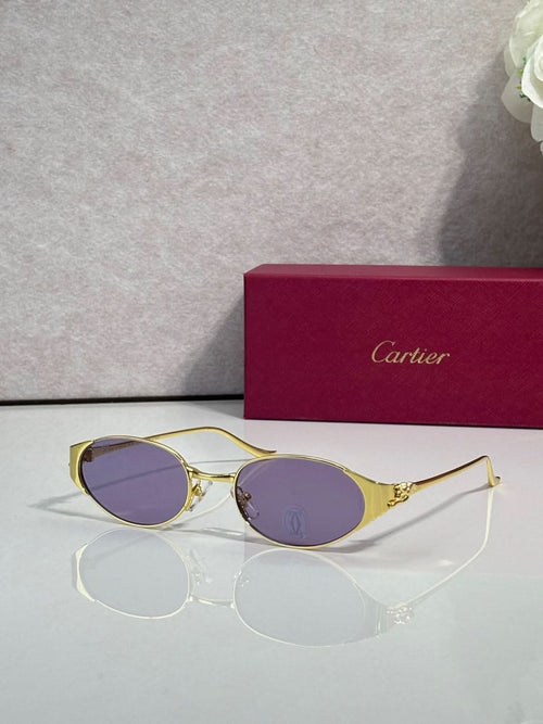 Cartier sunglasses with gold frames and purple tinted oval lenses