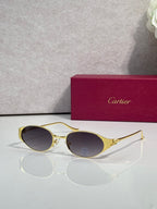 Cartier sunglasses with gold frames and dark round lenses