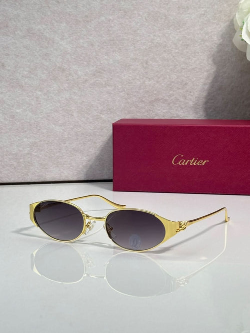 Cartier sunglasses with gold frames and dark round lenses