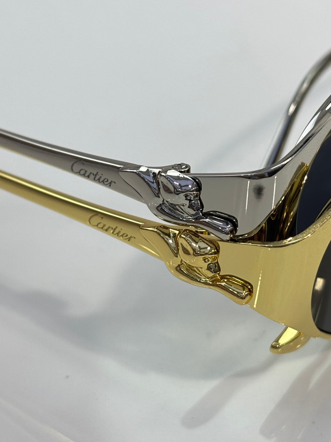 Cartier sunglasses close-up of gold-and-silver hinge detail