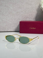 Cartier sunglasses with gold frames and green tinted oval lenses