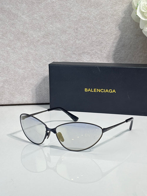 Cat-eye sunglasses with thin metal frame, black temples, neutral-tinted lenses