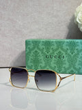 Gucci glasses with gold-tone square frames and dark gradient lenses