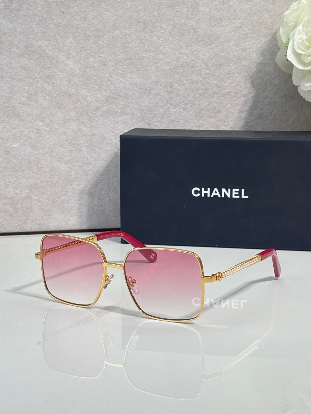 CHANEL square sunglasses with gold frames and pink gradient lenses