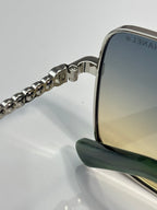 CHANEL sunglasses side arm close-up with silver chain detail