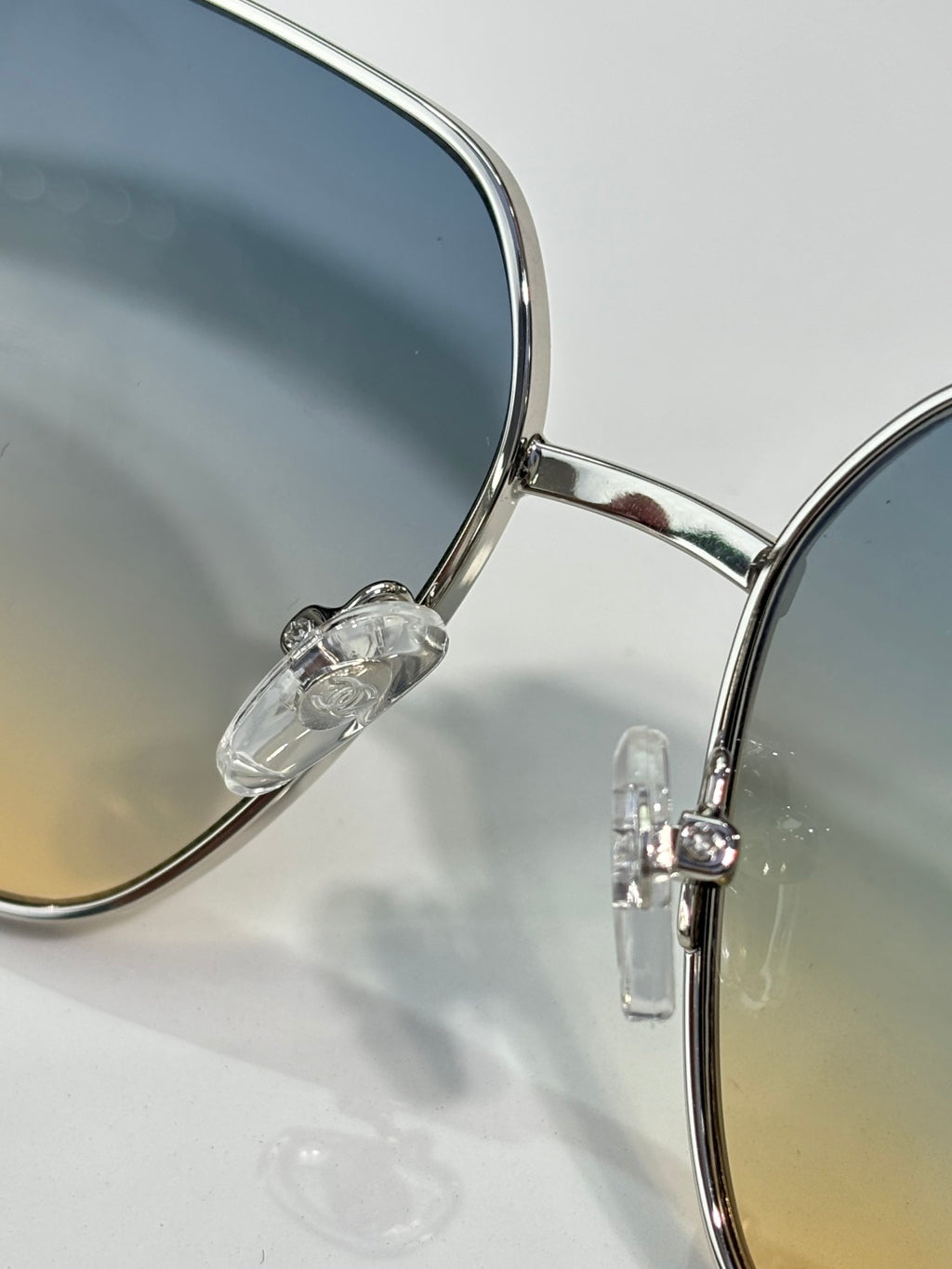 CHANEL sunglasses close-up with round lenses and silver metal frame