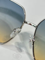 CHANEL sunglasses close-up with round lenses and silver metal frame