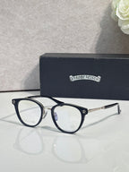 Dark navy round eyeglasses with thin metal arms and clear lenses