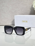 Black Dior sunglasses with square frames and gold logo hardware.
