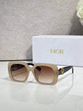 Dior sunglasses with beige square frames, brown gradient lenses, and gold logo detail