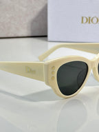 Dior ivory cat-eye sunglasses with dark lenses and side logo