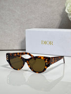 Dior tortoiseshell cat-eye sunglasses with dark brown lenses