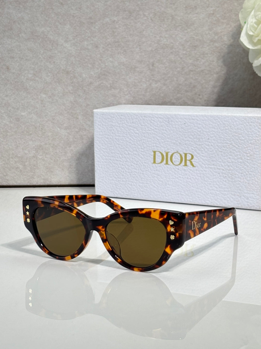 Dior tortoiseshell cat-eye sunglasses with dark brown lenses
