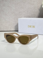 Dior cream cat-eye sunglasses with olive-brown lenses and star details