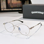 Round metal eyeglasses with clear lenses, silver frame, and black temple tips
