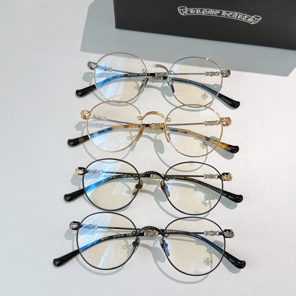 Assorted round metal eyeglasses with clear lenses in dark, silver, and gold tones