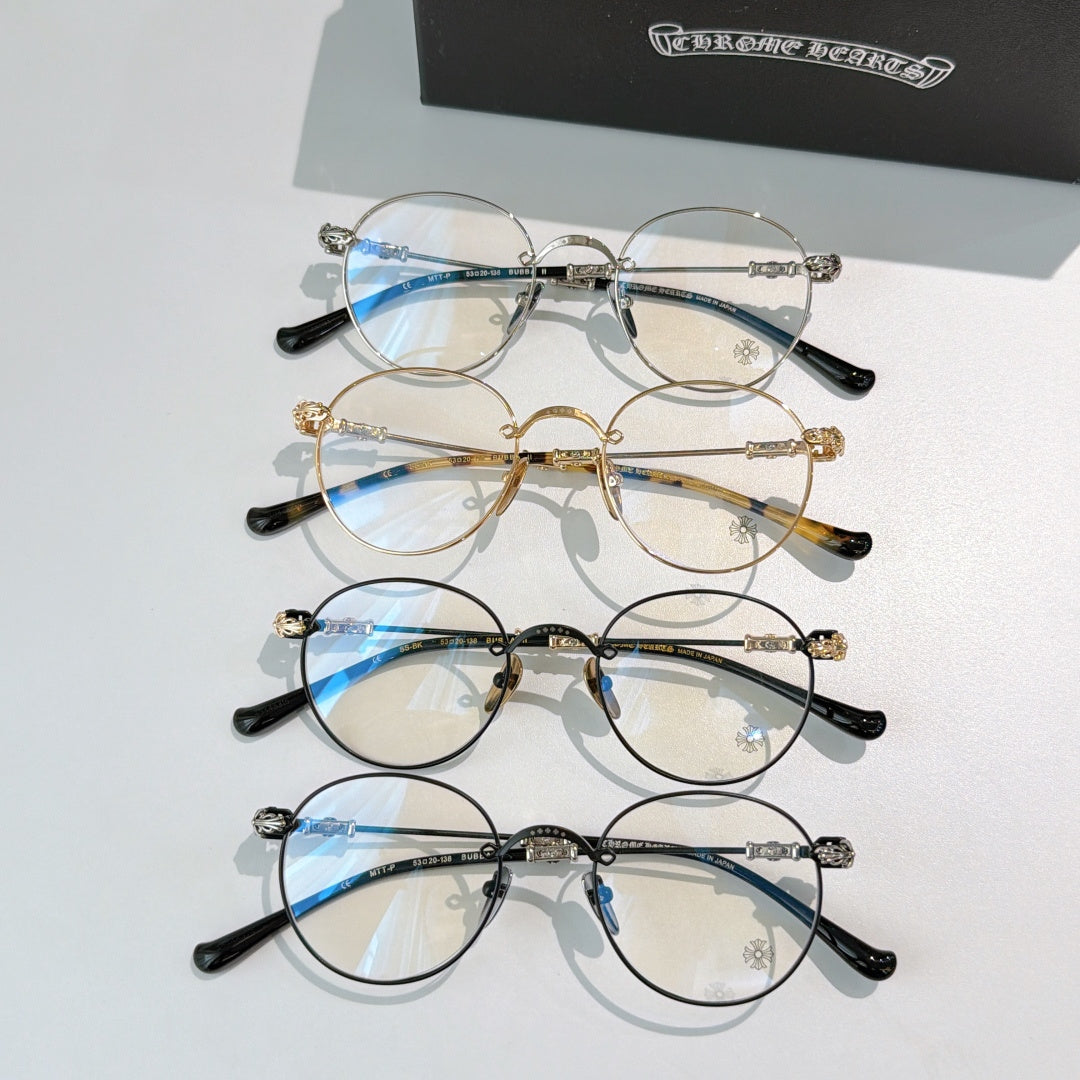 Assorted round metal eyeglasses with clear lenses in dark, silver, and gold tones