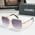 Chanel cat-eye sunglasses with gold-tone frame and purple gradient lenses