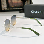 Chanel sunglasses with silver-tone frame, pearl chain detail, and green arms