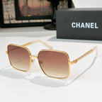 Chanel cat-eye sunglasses with gold-tone frame and warm brown gradient lenses
