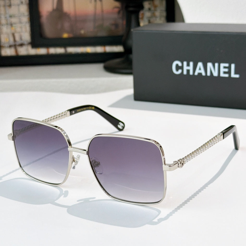 Chanel cat-eye sunglasses with silver-tone frame and purple gradient lenses