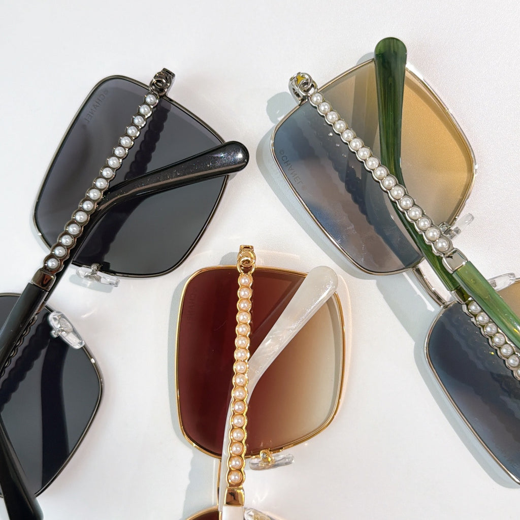 Chanel sunglasses with pearl temple chains and tinted lenses in mixed frames