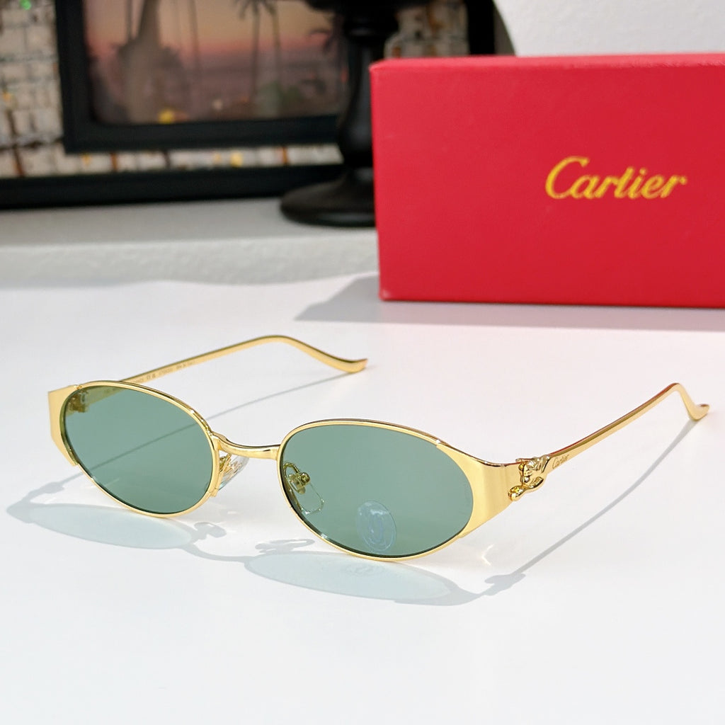 Round gold-tone sunglasses with green-tinted lenses and metal bridge detail