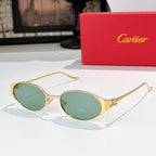 Round gold-tone sunglasses with green-tinted lenses and metal bridge detail