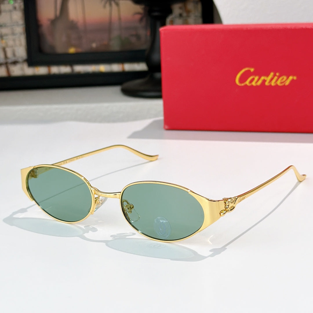 Round gold-tone sunglasses with green-tinted lenses and metal bridge detail