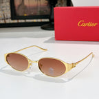 Round gold-tone sunglasses with rose-tinted lenses and metal bridge detail