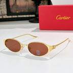 Round gold-tone sunglasses with warm brown-tinted lenses and metal bridge detail