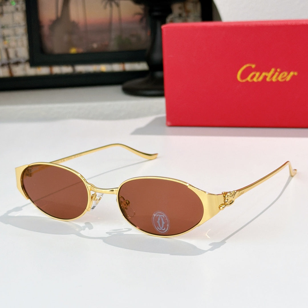 Round gold-tone sunglasses with warm brown-tinted lenses and metal bridge detail