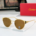 Gold-rimmed round sunglasses with amber-tinted lenses and decorative metal temples