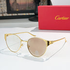 Gold-rimmed round sunglasses with clear lenses and slim metal temples