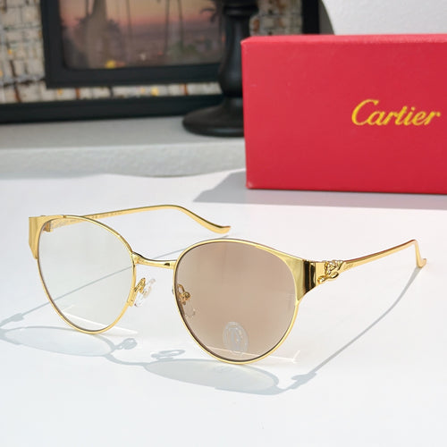 Gold-rimmed round sunglasses with clear lenses and slim metal temples