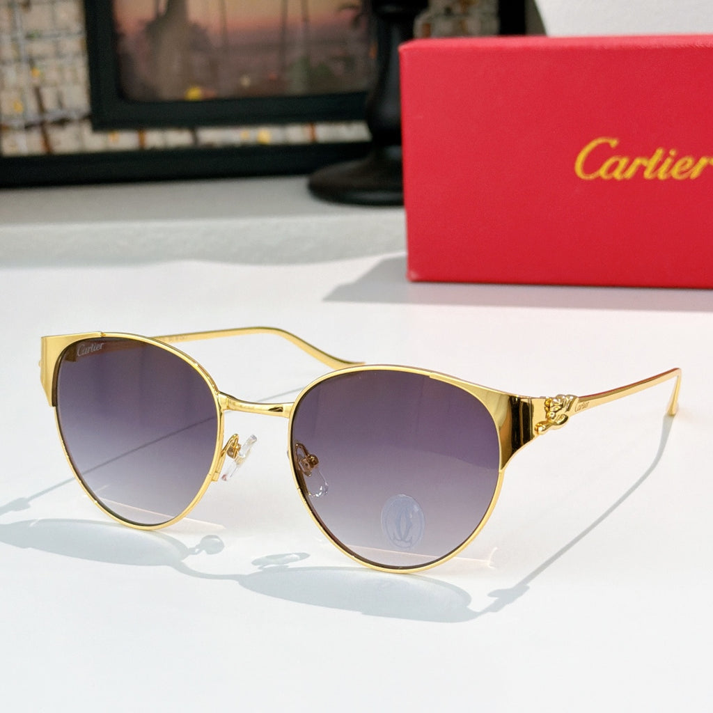 Gold-rimmed round sunglasses with dark purple lenses and slim metal temples