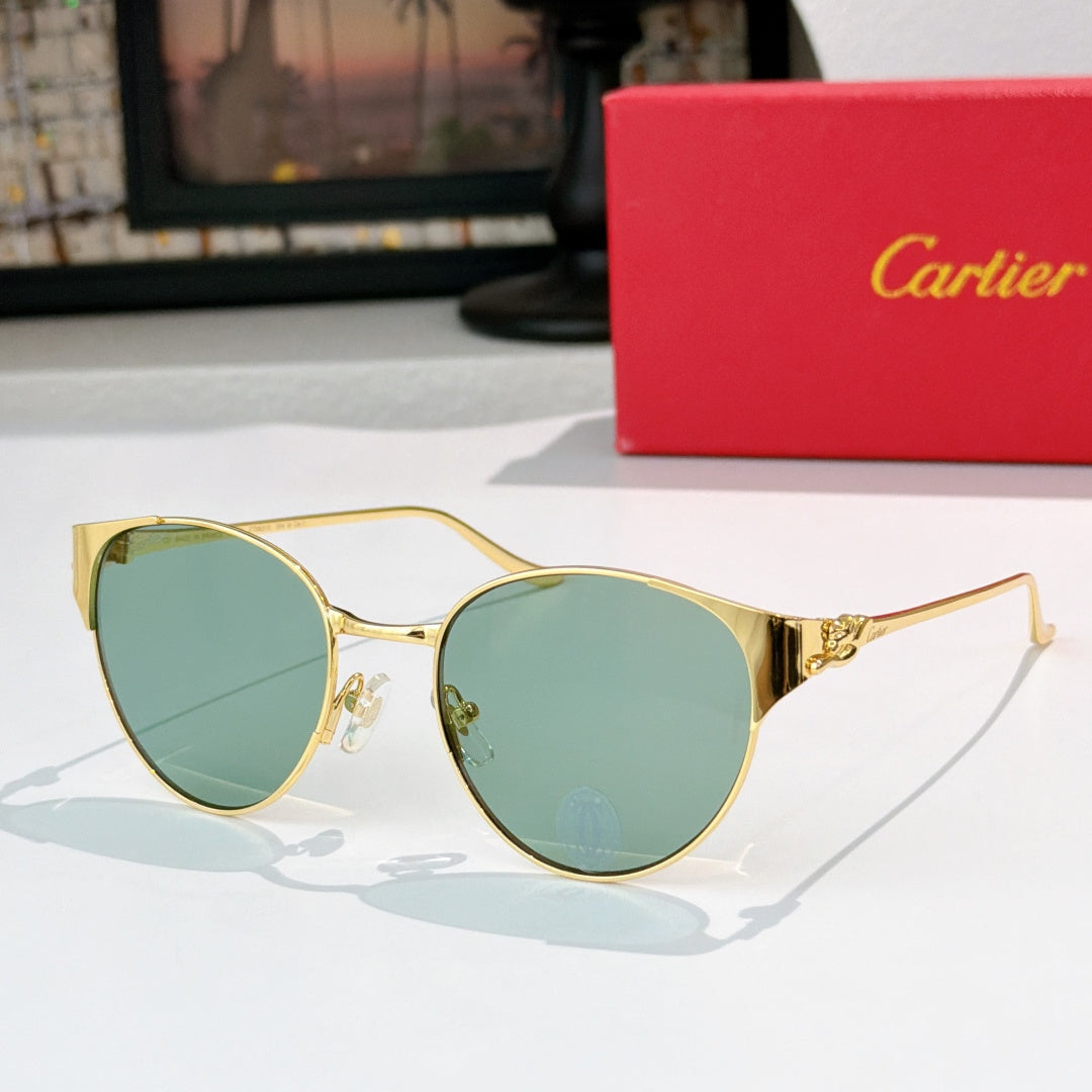 Gold-rimmed round sunglasses with teal-tinted lenses and slim metal temples