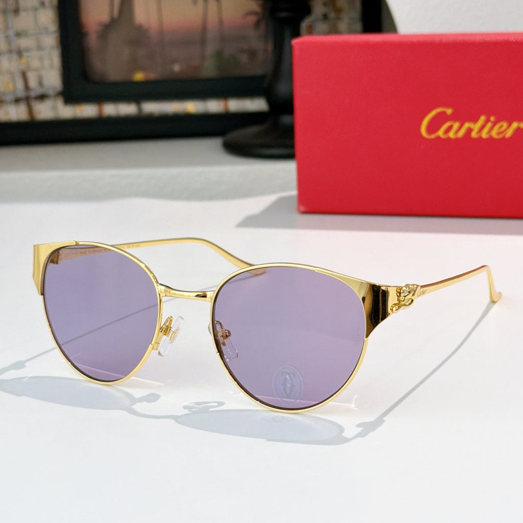 Gold-rimmed round sunglasses with light purple lenses and ornate metal temples