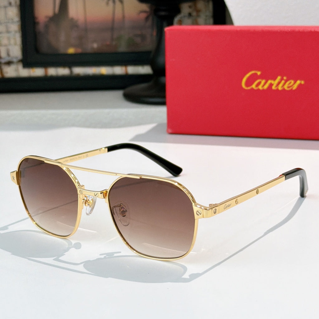 Sunglasses with gold frame, black temples, and brown tinted round lenses