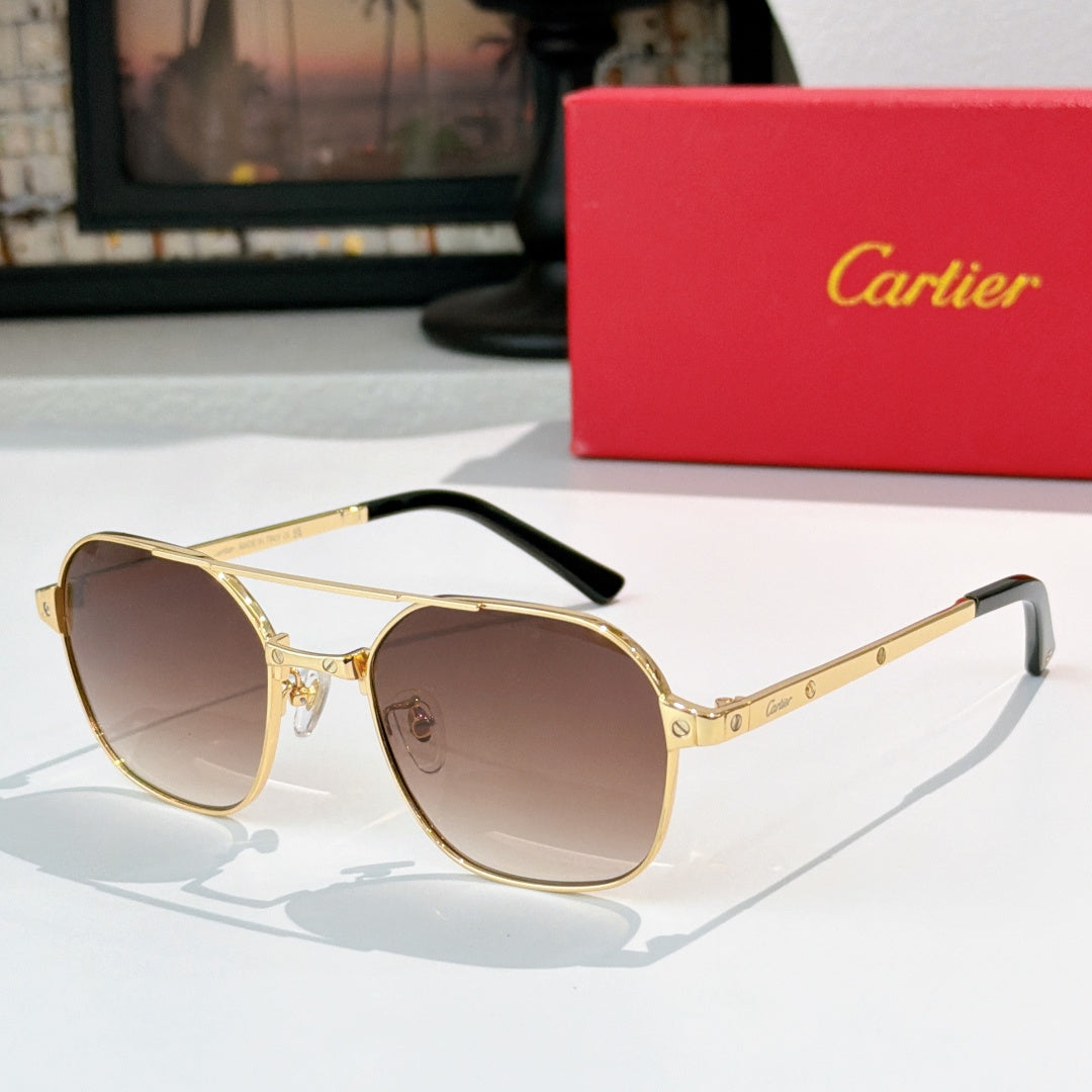Sunglasses with gold frame, black temples, and brown tinted round lenses
