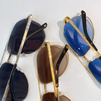 Assorted aviator sunglasses with mixed metal frames and tinted lenses