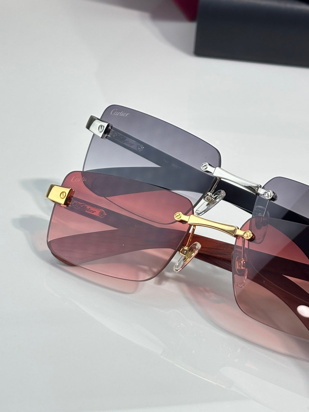 Cartier sunglasses with pink lenses, gold-tone and silver-tone frames, square shape