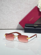 Cartier eyeglasses with tortoise-style frame and gold-tone hinge, pink tinted lenses