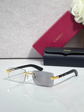 Cartier eyeglasses with black frame and gold-tone hinge, clear lenses, rectangular shape