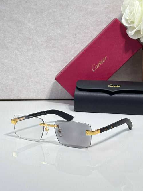 Cartier eyeglasses with black frame and gold-tone hinge, clear lenses, rectangular shape